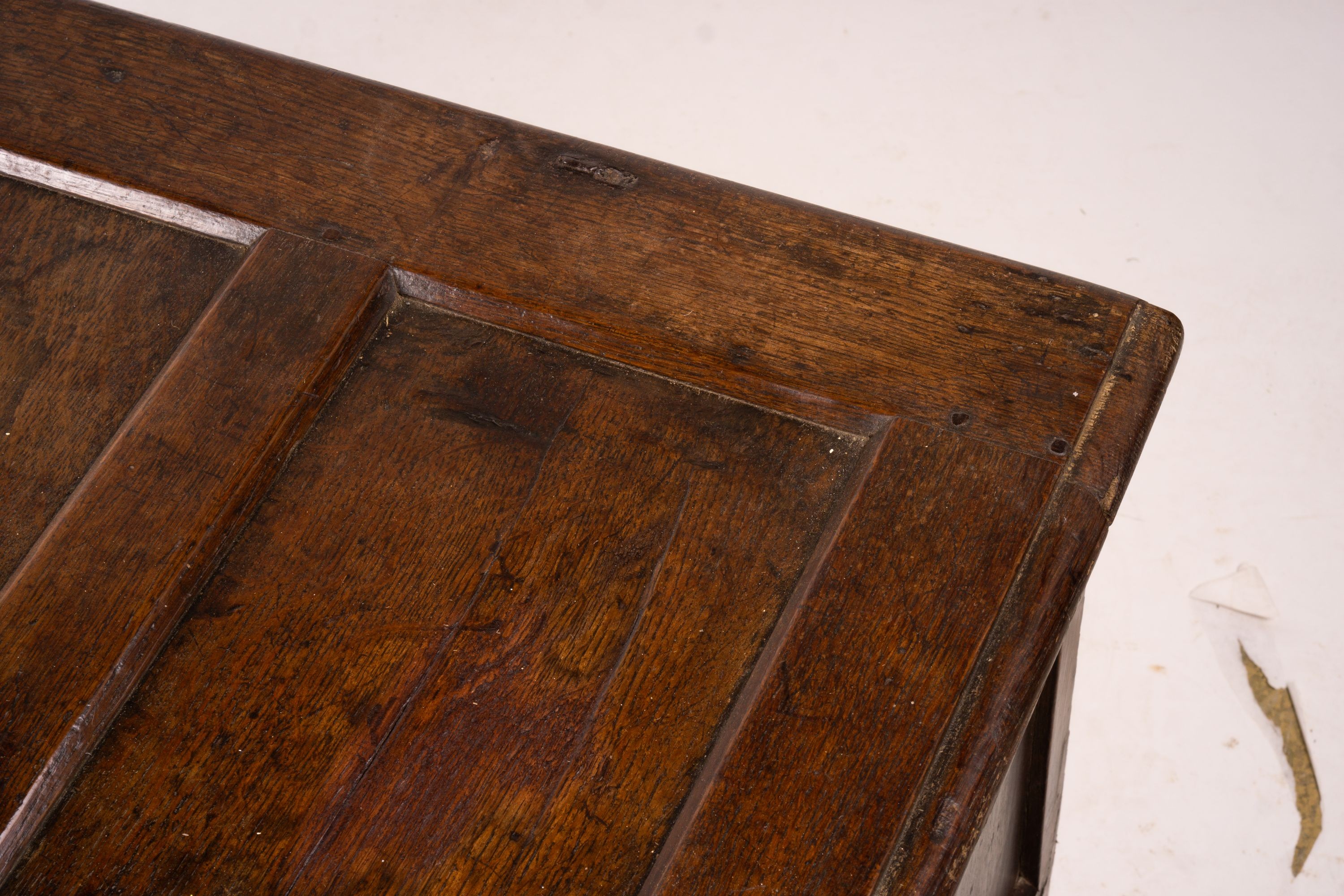 A 17th century panelled oak coffer, W.122cm D.55cm H.65cm